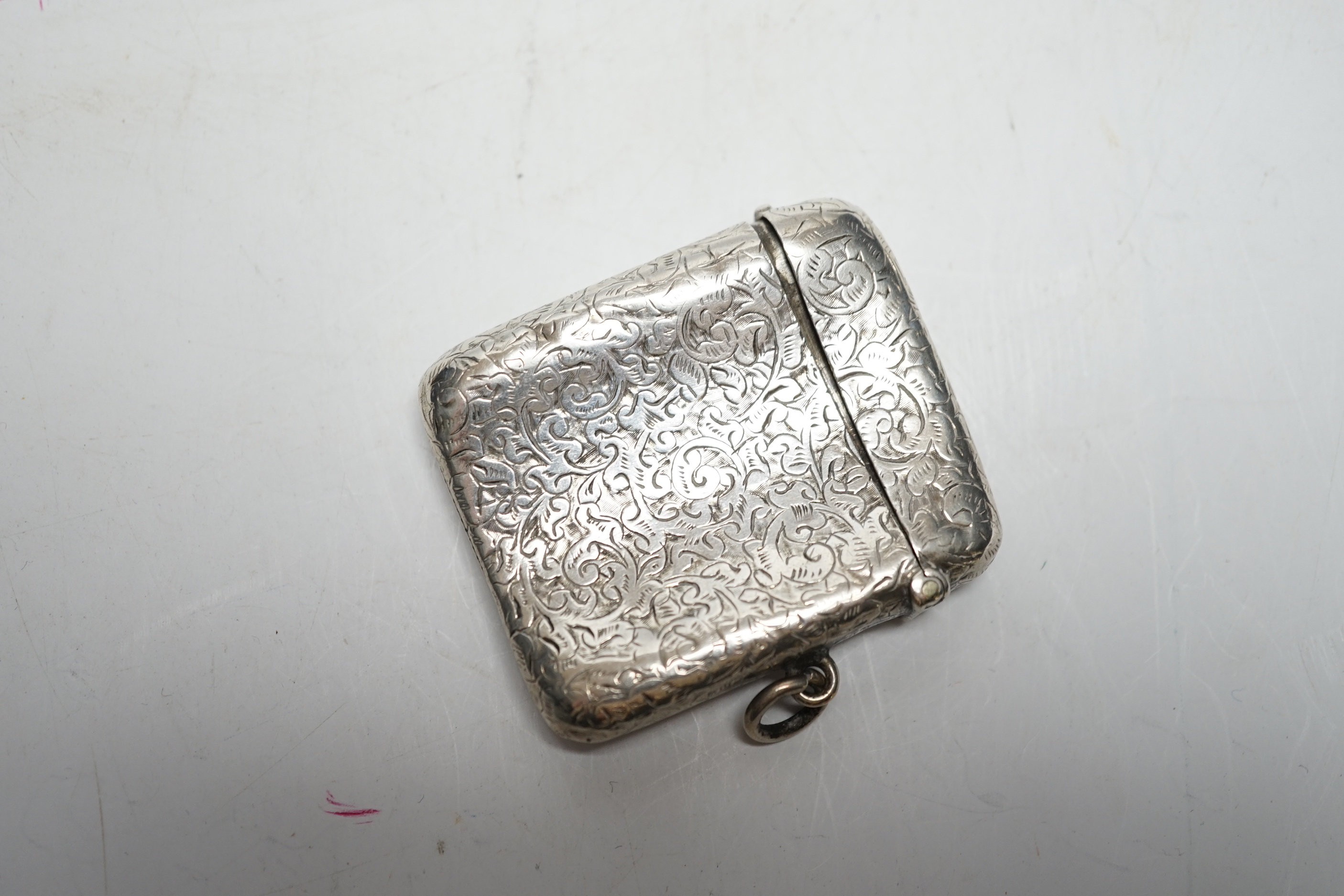 Sundry small silver and white metal items including a George V handbag mirror, vesta case, needle case, basket pin cushion, etc.